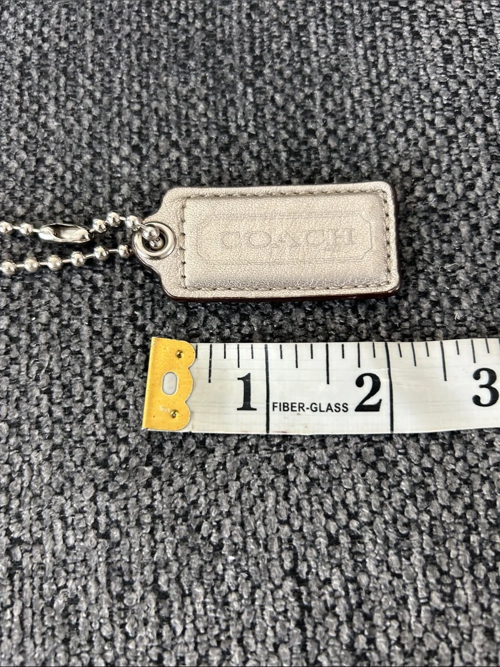 COACH Metallic Gold Leather Hang Tag